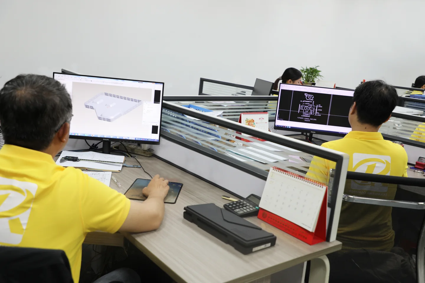 Ruishuo engineer reviewing a CAD model and drawing